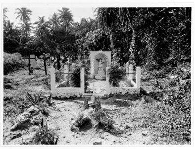 Grave and tombstone at graveyard in Agana, Guam, circa 1930