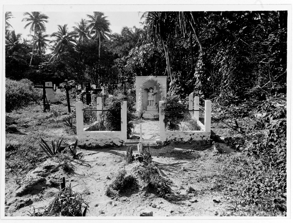 Grave and tombstone at graveyard in Agana, Guam, circa 1930