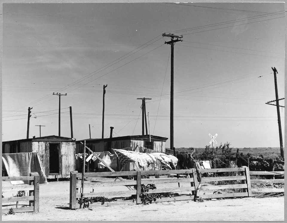 Grayson, Westley, Stanislaus County, San Joaquin Valley, California. Old box cars on railroad right . . . - NARA - 521693