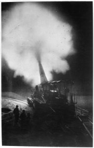 Greatest French gun (320mm) at moment of firing during a night bombardment. The belch of smoke from the explosion of... - NARA - 533675