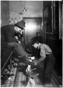 Greel's Shoe-Shining Parlor. Said he was 15 years old. Works some nights until 11 P.M. Indianapolis, Ind. - NARA - 523072