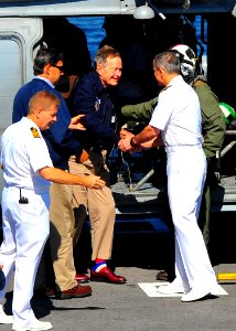 Former President George H.W. Bush arrives aboard the aircraft carrier USS George H.W. Bush (CVN 77). (7361618164)