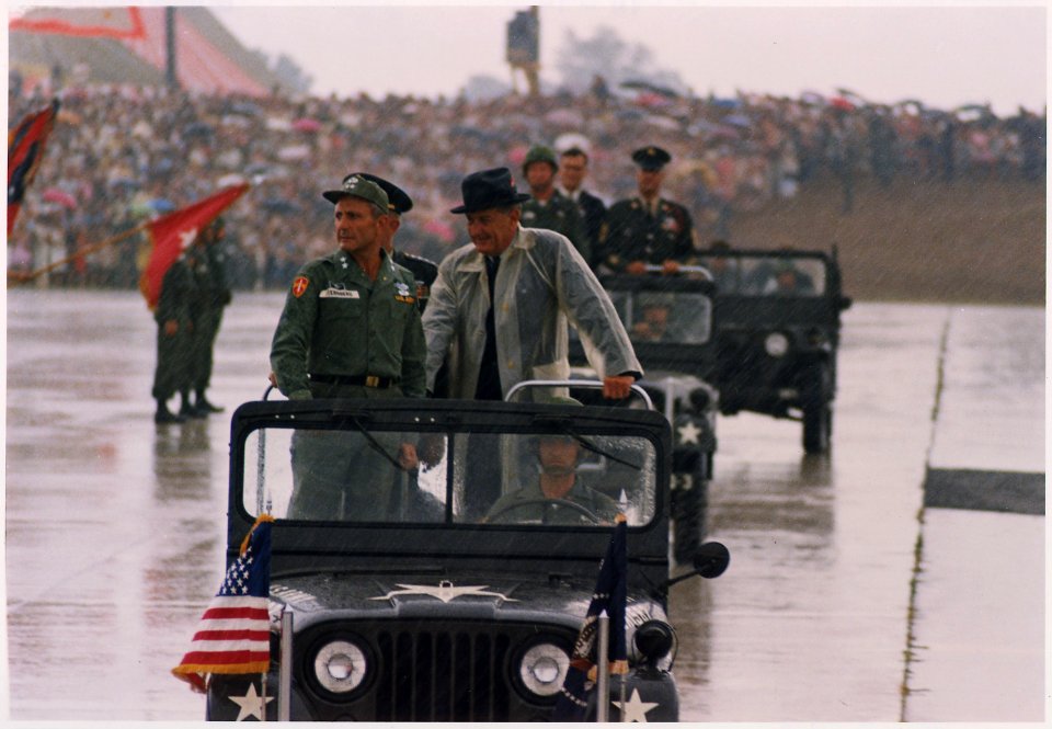Fort Campbell, Kentucky, President Lyndon B. Johnson and Major General Ben Sternberg in jeep during a rainstorm - NARA - 192520