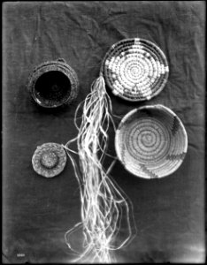 Four unidentified Indian baskets on display, ca.1900 (CHS-3964)