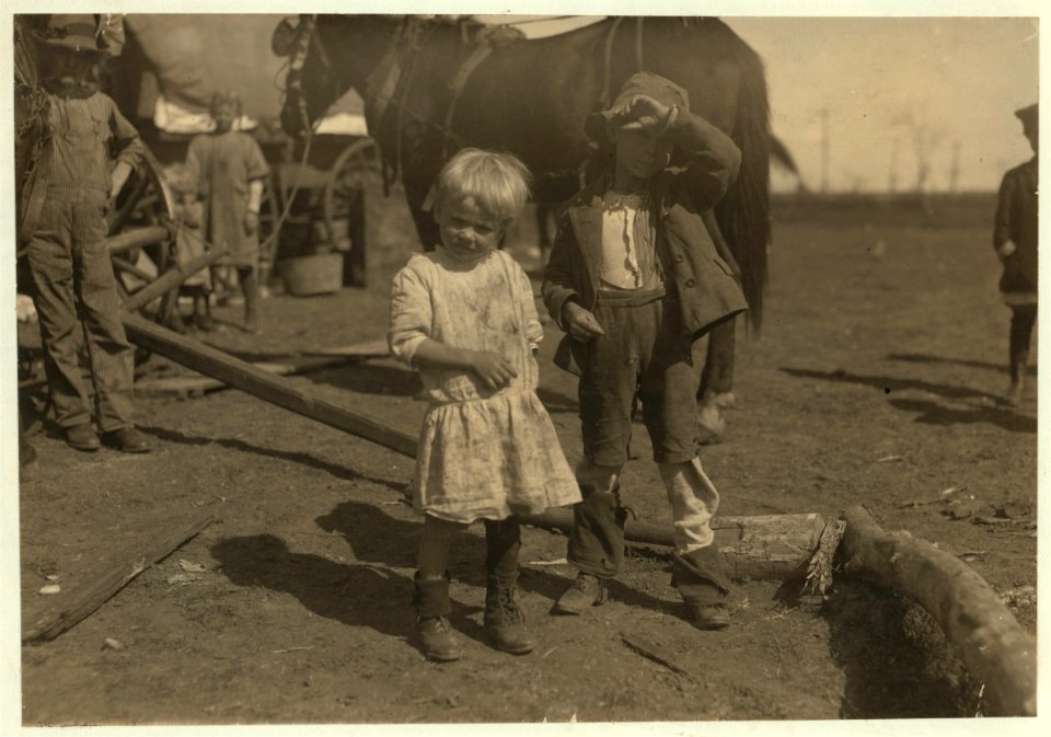 Four year old cotton picker who picks fifteen pounds a day regularly and seven year old who picks fifty pounds a day. They live in emigrant wagons. Moving about from farm to farm. LOC nclc.00221