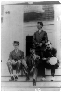 Four men, friends of Frances Benjamin Johnston, posed on porch LCCN92500550