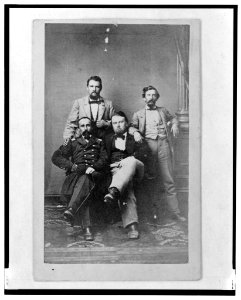 Four unidentified men including at least one Union officer, full-length portrait, seated and standing, facing front LCCN2003679615