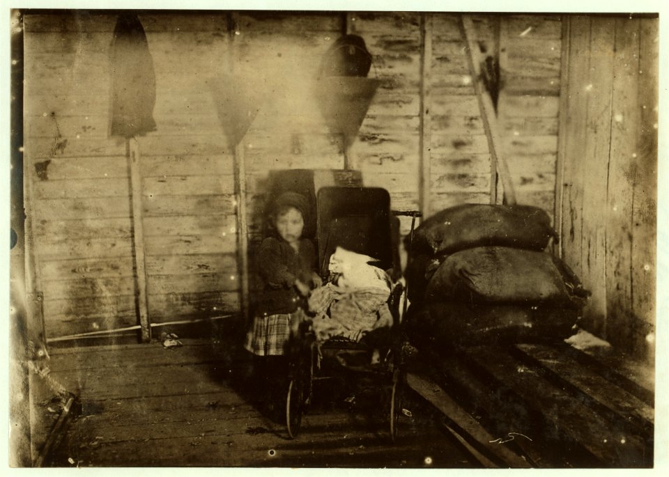 Four-year-old Mary Davis, tending the sick baby when not working. (See photo 2039). LOC nclc.00921