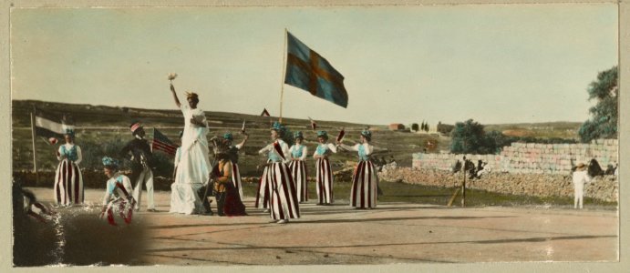 Fourth of July pageant at the American Colony, Jerusalem, showing women wearing red, white, and blue costumes carrying flags and a man and woman dressed as Uncle Sam and the Statue of LCCN2008676307