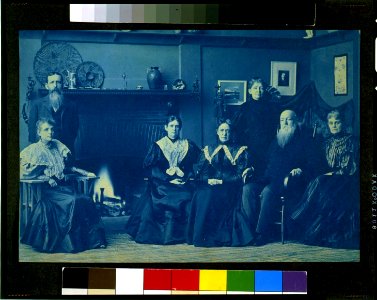 Frances Benjamin Johnston posed with six members of her family, by fireplace, in her Washington, D.C. studio LCCN97510863