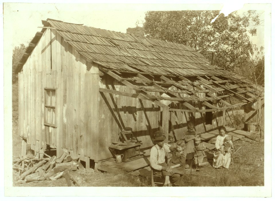 Frank Burditt and family. They rent this dilapidated shack and are trying to make a living off the meagre land near by. Oct. 11, 1921. LOC nclc.04424