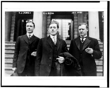 Frank J. Hayes, E.L. Doyle, Jas. Lord, three-quarter length portraits, facing front, standing outside building LCCN91711138