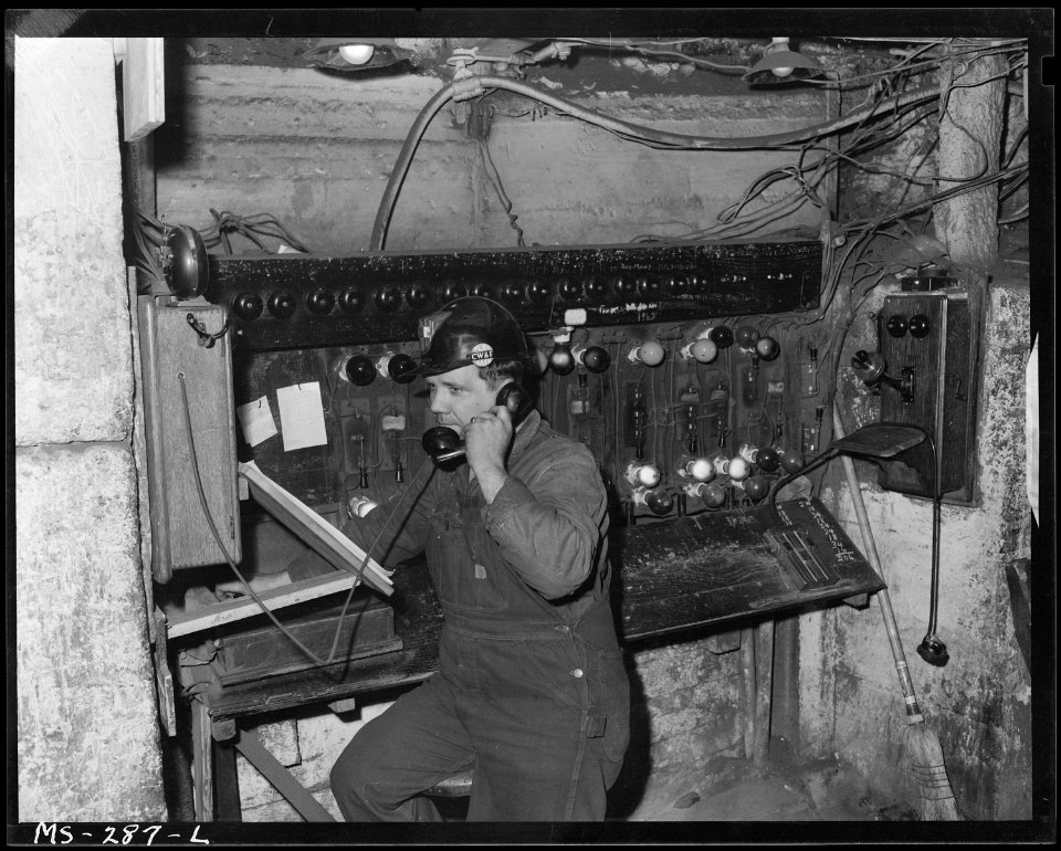 Frank Knapp at his main dispatcher's station underground. He controls traffic of shuttlel cars. Chicago, Wilmington &... - NARA - 540343