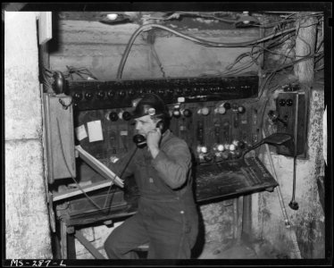 Frank Knapp at his main dispatcher's station underground. He controls traffic of shuttlel cars. Chicago, Wilmington &... - NARA - 540343