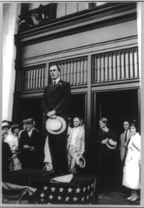 Franklin D. Roosevelt, full length, standing, facing left; holding hat and speaking LCCN2005686568
