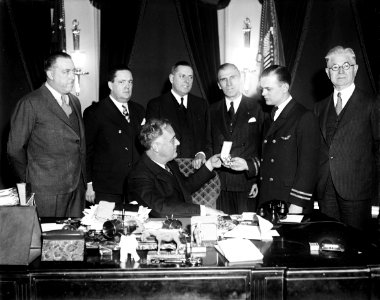 Franklin Roosevelt at desk in Oval Office, 1933 photo