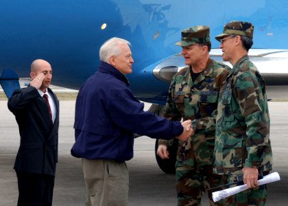 Gregory Martin and R. Michael Worden greet Joe Knollenberg