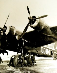 Ground staff pushing a Stirling aircraft for overhaul, 1942-43 (27846331956)