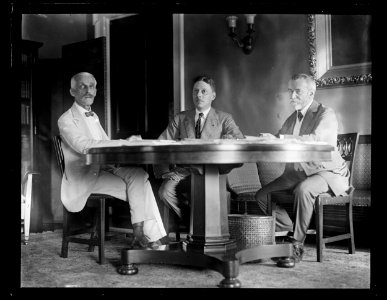 Group at table; Andrew W. Mellon, left, J.J. Jusserand, right LCCN2016891546