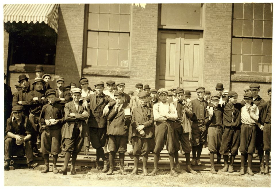 Group in front of Indian Orchard Mfg. Co. Everyone in photo was working. Boy not photographed. Hector Dubois, 24 Water St. Doffer in Indian Orchard; crushed finger in pump. LOC nclc.02282