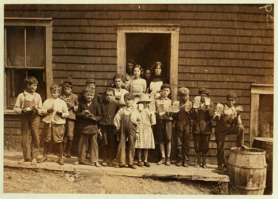 Group of 'cartoners' in Seacoast Canning Co., Factory -7. Everyone of them works putting cans of sardines into paper cartons. Eleven out of the fourteen were under twelve years. Several from LOC cph.3b33767