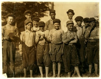 Group of boys in the Belton Cotton Mill. The smallest is Milton Honicutt, 11 years old according to the bible and James Taylor. His parents wouldn't show me the family record. LOC nclc.02614