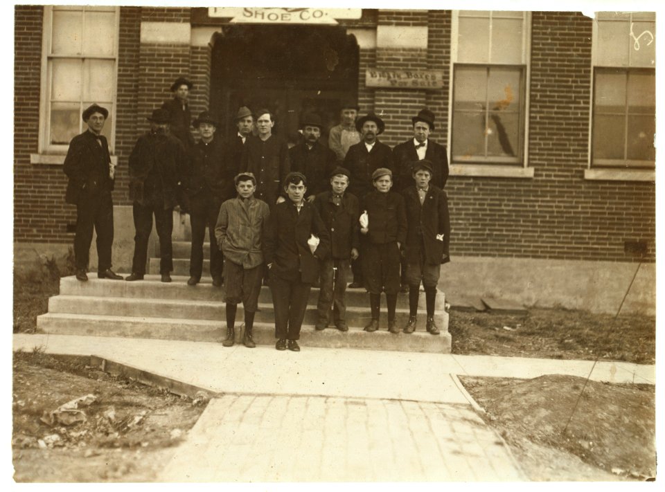 Group of boys working in Friedman Shelby Shoe Co., 6-30 A.M. The youngest, Vehnie Hughes, said he was 12 years old and had been working one year. Others are Hobson Waters, Elmer Behan, Ora LOC nclc.04700