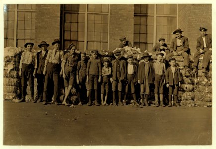 Group of boys working in Lancaster, S.C. Cotton Mills. Smallest boy in middle said has been in the mill off and on for 5 yrs. Spins now. Nov. 30, 1909(sic). LOC nclc.01431