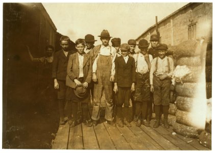 Group of boys working in Woodstock Cotton Mills. Smallest boy is Will Earwood, said he had been working there six years. Another small boy said he had been working there nearly ten years. LOC nclc.01928