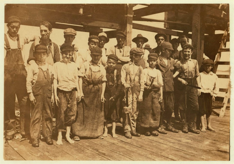 Group of cutters, all of them working, factory -2. One of them, not the youngest, is Harold Whalen, 14 Tappen Ave. Makes $1.00 a day. LOC nclc.00950