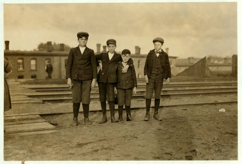 Group of boys working in Great Falls Mfg. Co., Somersworth, N.H. 6 p.m. May 18, 1909. Smallest boy is Alfred Ouellet, 212 Main Street. Fat boy is Willie Laudry, 35 South Street. Boy on left LOC cph.3b24158