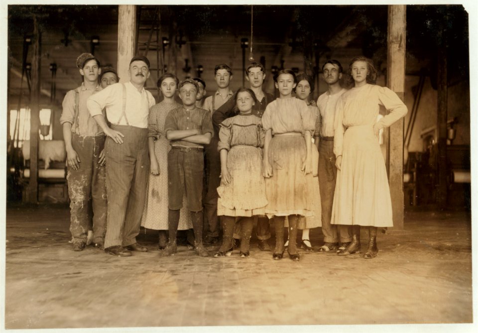 Group of card-room hands in Richmond Spinning Mills. Smallest girl in the middle is a doffer. LOC nclc.01969