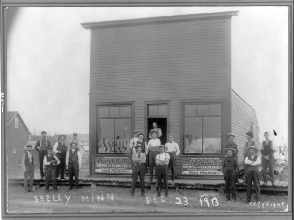 Group of men standing in front of Fred Peerson's paint store. Shelly, Minnesota. Dec. 23, 1913 LCCN2007683009
