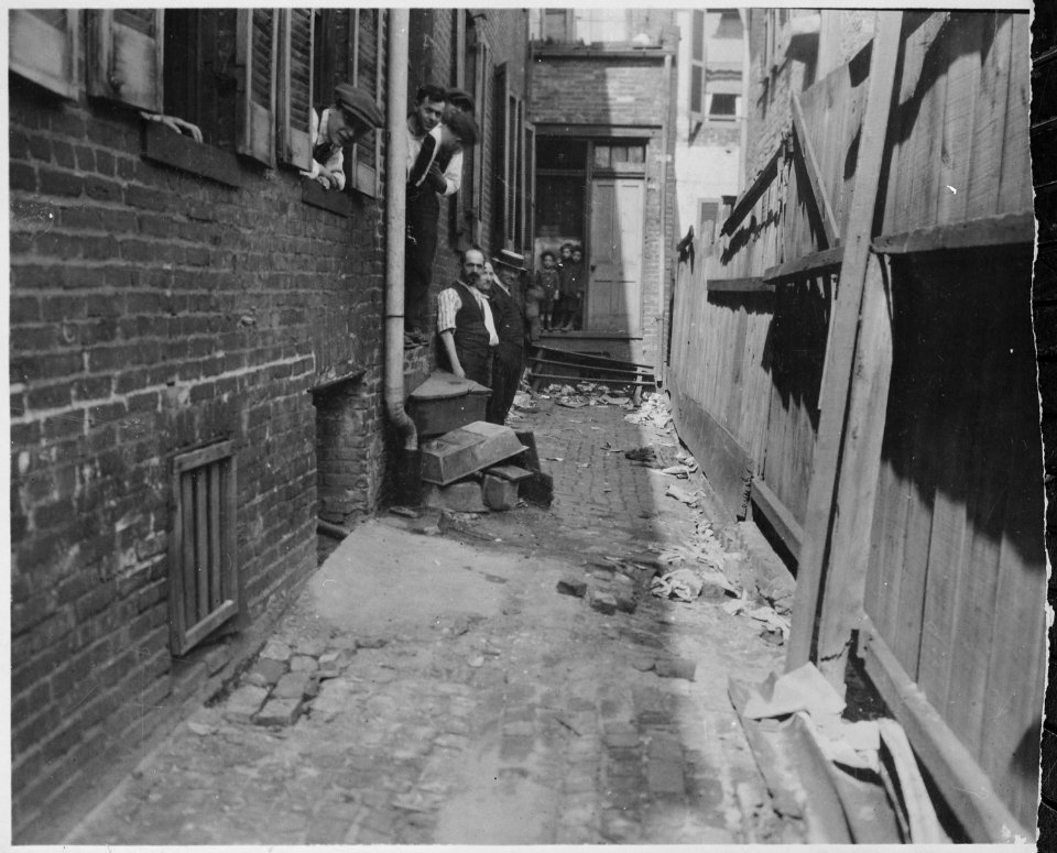Group of Employees and Several Small Boys in the Littered Alley Entrance to a Baltimore Garment Factory (3904010342)