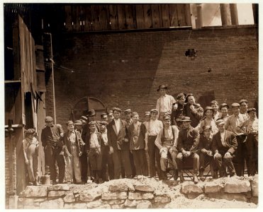 Group of glass workers Shops 6 & 7, Illinois Glass Co. 12-45 P.M. Even the tiny chap on left end of photo was working. He is a Polish boy who cannot understand English. I saw him at work LOC nclc.01291