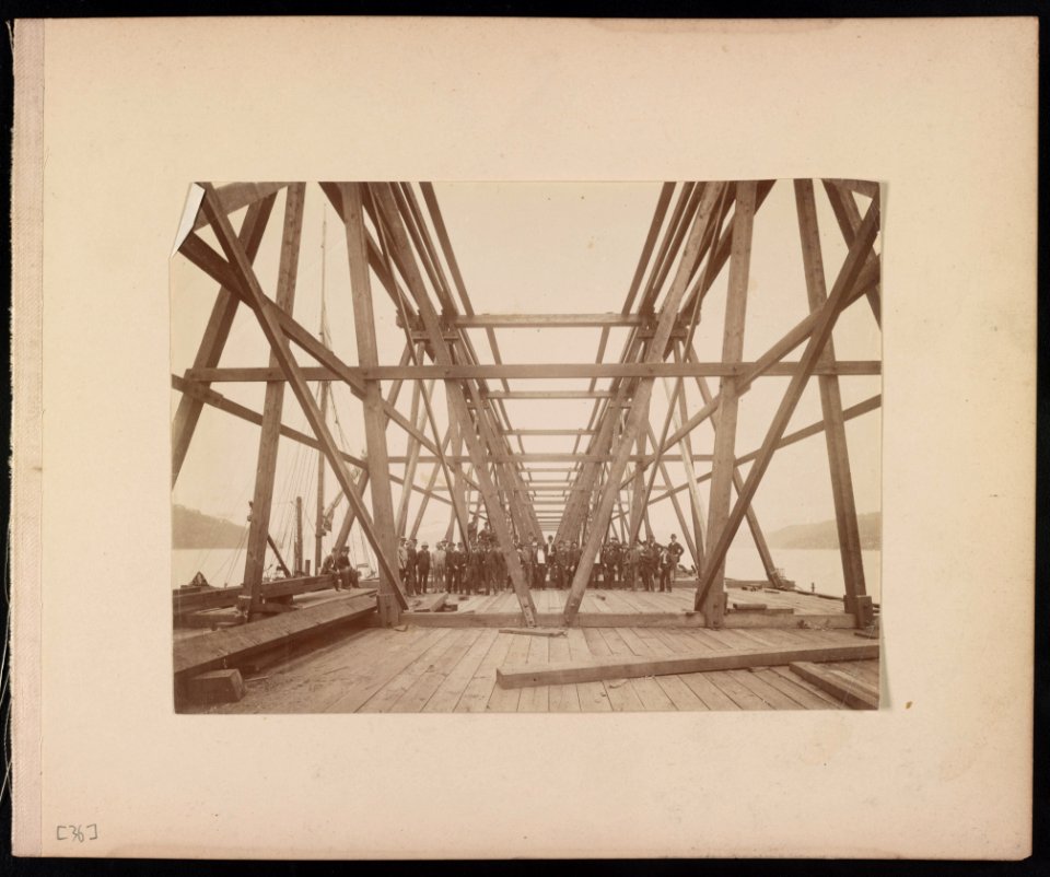 Group of men in suits standing on the Hawkesbury Bridge, New South Wales, Australia LCCN2016652518