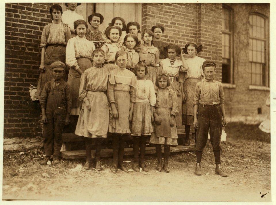 Group of spinners in Elk Cotton Mills. Youngest girl hardly knew her name. Youngest boy runs two sides at ten cents each a day. LOC nclc.01899