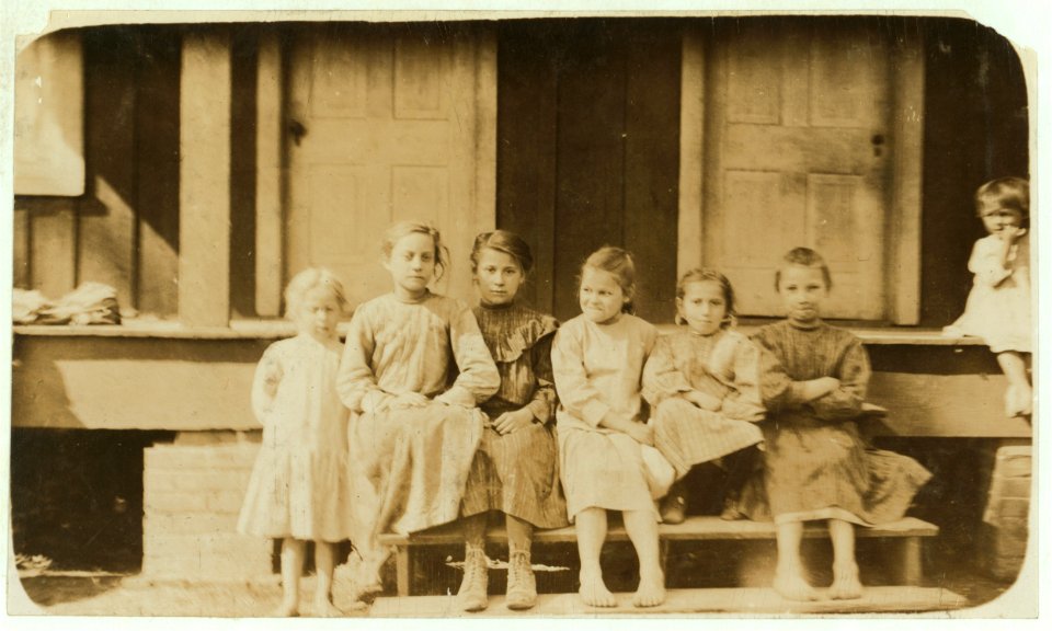 Group of oyster shuckers. Even little Tenny on the left shucks. She did not know how old she was. LOC nclc.00849