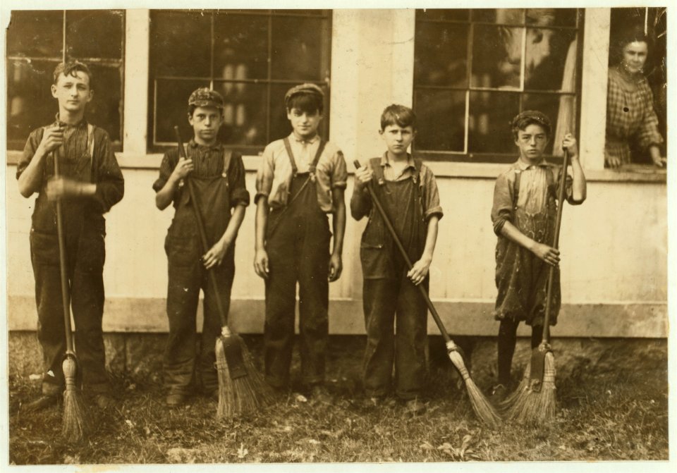 Group of sweepers and doffers in the filling spinning room of Glenallen Mill. The boys were smuggled out of back window during hours by second hand. All work. Smallest boy is Francis LOC nclc.02320