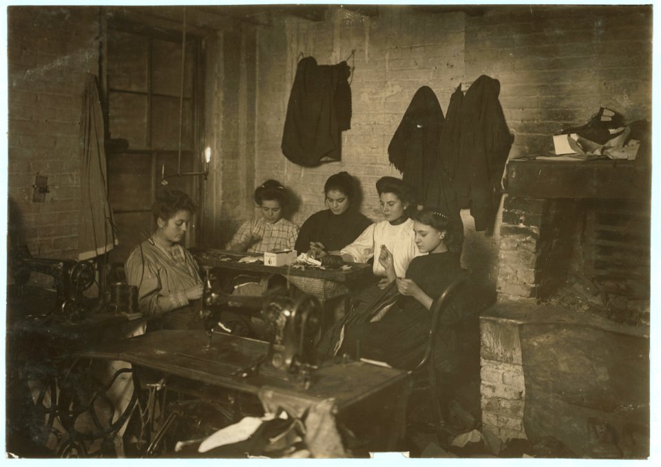 Group of women in sweatshop of Mr. Sentrei, 87 Ridge Street, second inner court. Small girl is Mamie Gerhino, 202 Elizabeth Street. She might have been 14 years old. Photo 5 P.M., February LOC cph.3b03845