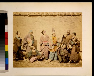 Group of street musicians and actors in front of a building with reed or bamboo blinds LCCN2009632888