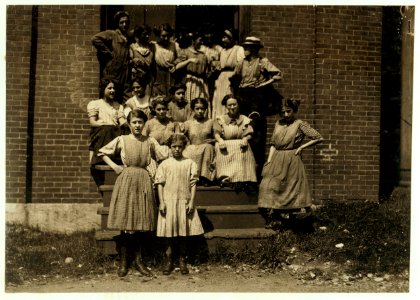 Group of workers in Glenallen Mill. Smallest girl helps her sister Dora Roberts in mill. Lives at 13 Woodlawn St., there are 13 in the family, five or six working. Apparently prosperous. In LOC nclc.02319