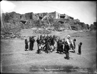 Group of twenty-two Hopi Indian children at Oraibi scrambling for candy thrown to them, Arizona, ca.1898 (CHS-4582)
