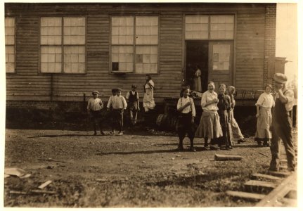 Group of workers in the Shaw Cotton Mills going home. Several violations. LOC nclc.02950