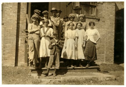Group of workers at the Dallas Cotton Mill. The small boy helps his sister. Eternal vigilance will be needed to keep these little ones out of the mill. LOC nclc.02860