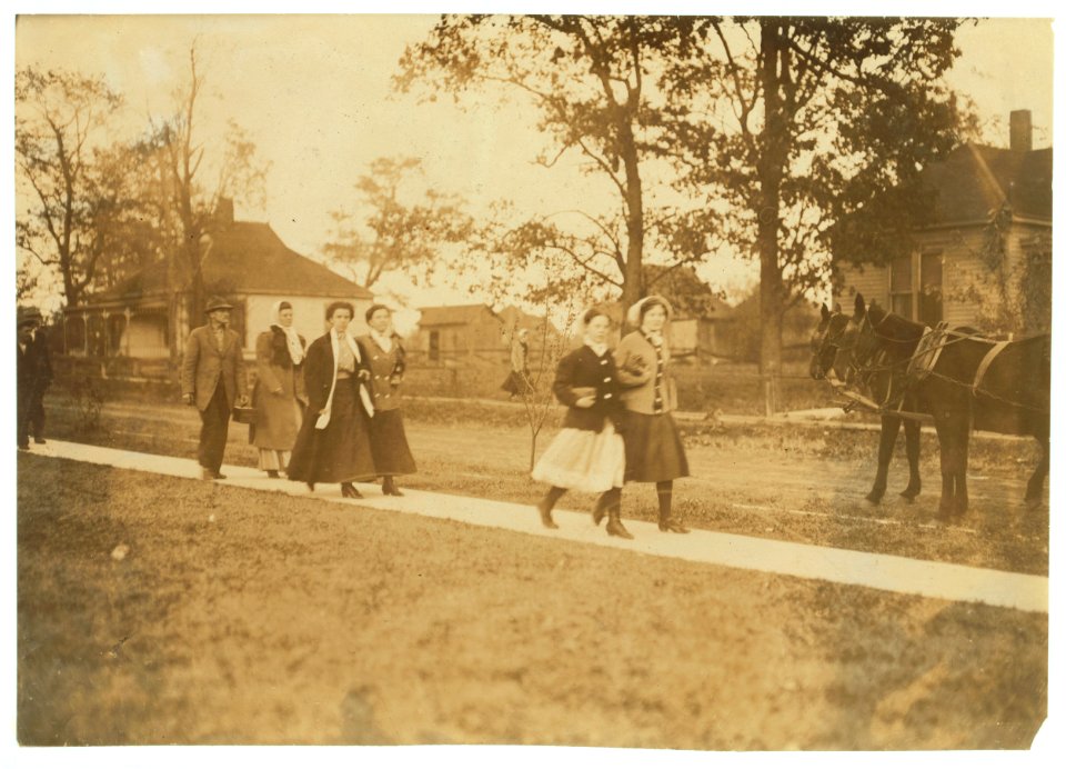 Group of workers coming out of Hamilton Brown Shoe Company. LOC nclc.04707