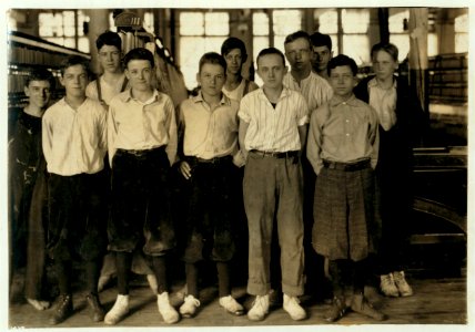Group of younger workers in mule room. All but two are 14 and 15 years old. Going home at 11 A.M. Berkshire Cotton Mills. LOC cph.3c01563