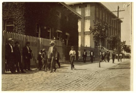Group of youngsters going in at noon to work in the mill. LOC nclc.02232
