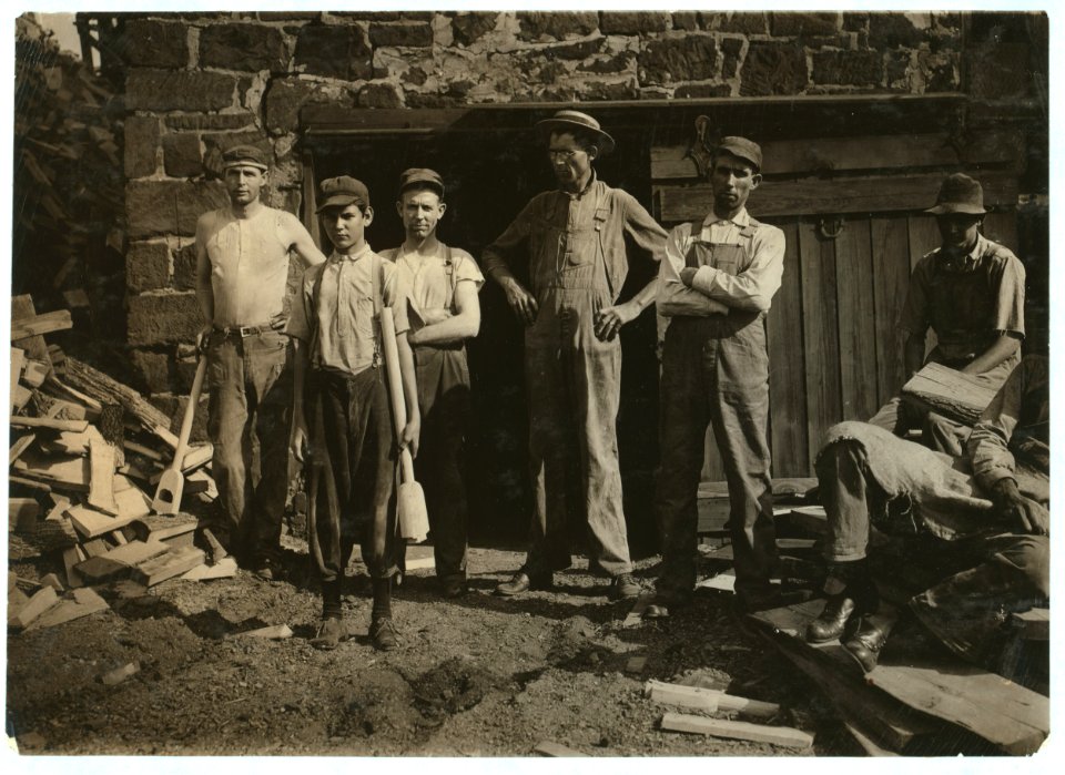 Group outside Pittman Handle Factory. A fifteen year old boy operating a dangerous boring machine at which he said a boy recently bored half his hand off. To operate this machine (which LOC cph.3b05704