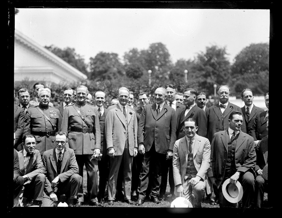 Group outside White House- includes John J. Pershing, right, Warren Harding, center, and William H. Taft, left LCCN2016891433